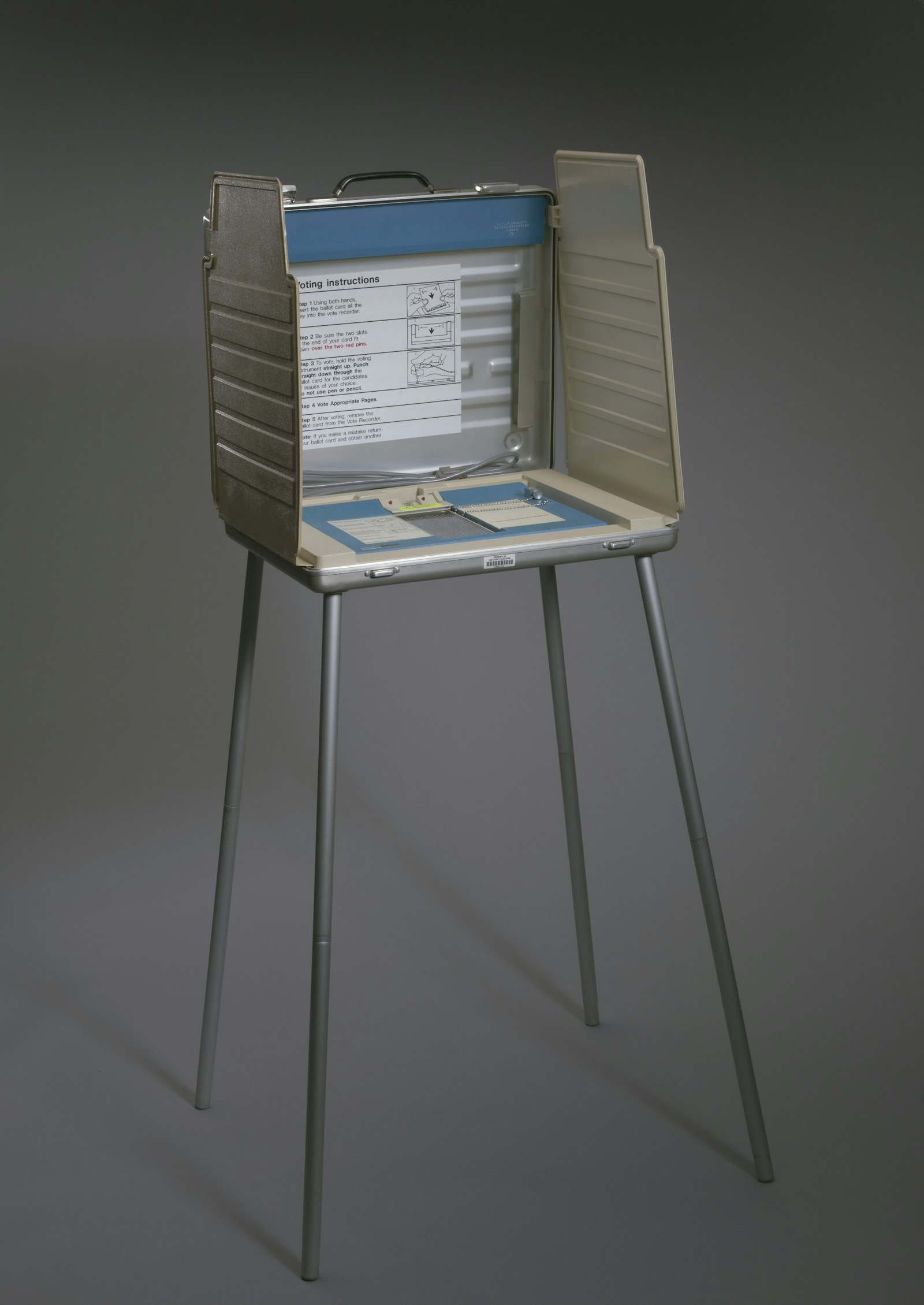 A portable Votomatic punch-card voting booth